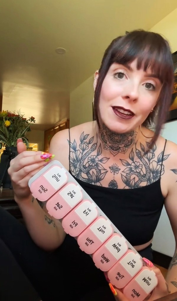 Belle Mourraille holds a pill organizer.