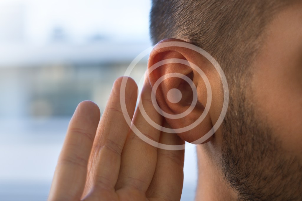 Pulsatile tinnitus can be caused by a number of factors - some benign and some more troubling. A young man with hearing loss is shown here.