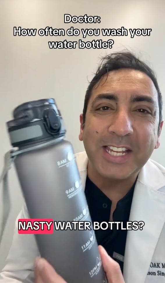 Dr. Jason Singh (pictured here on TikTok) reveals when and how to clean your water bottle to prevent bacterial biofilms from forming.