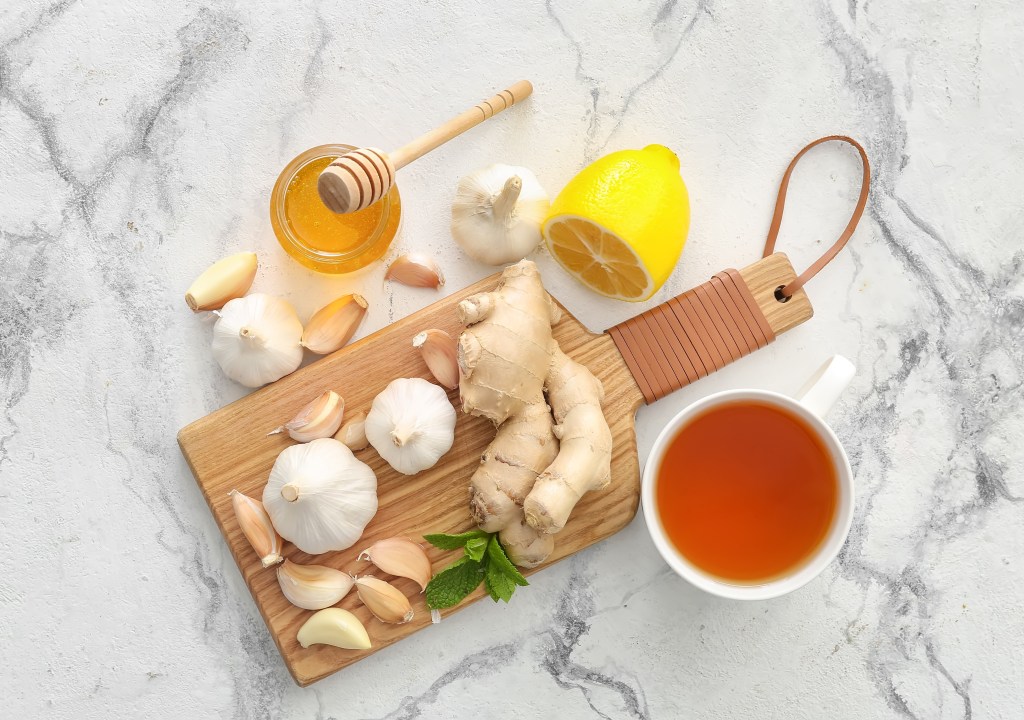 It's a mixture of garlic, ginger, eucalyptus oil, cayenne pepper, lemon juice, honey and hot water, some of which are pictured with a cup of tea.