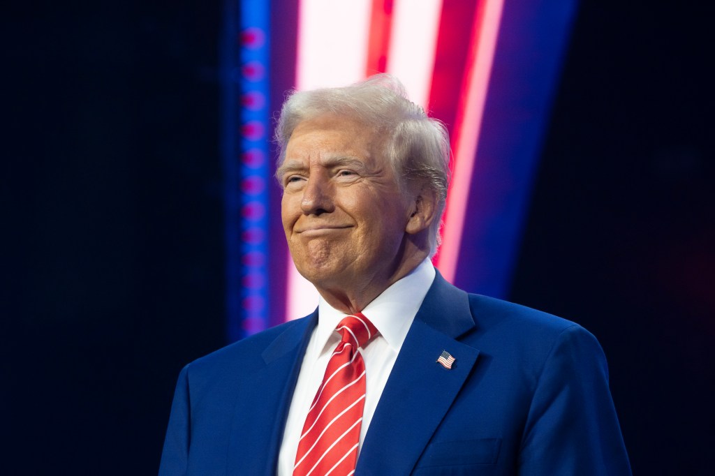 President-elect Donald Trump smiles during America's Turning Point Tour at the Phoenix Convention Center on December 22, 2024 in Phoenix, Arizona.