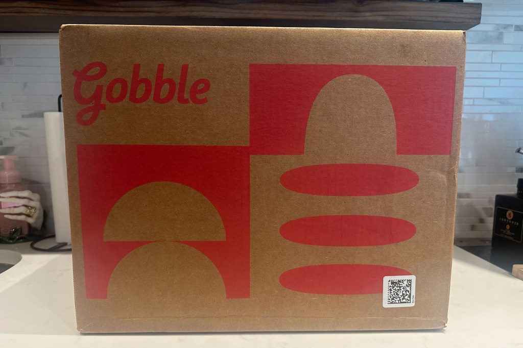 A cardboard box with red and yellow designs